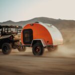 UTV pulling orange sunnyside offroad camper trailer