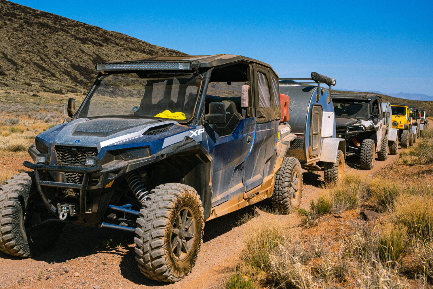 UTVs pulling teardrop camper trailer